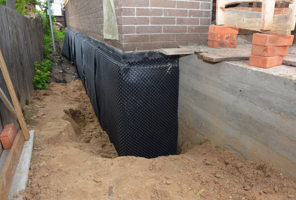 Happy homeowners after waterproofing job in Freehold